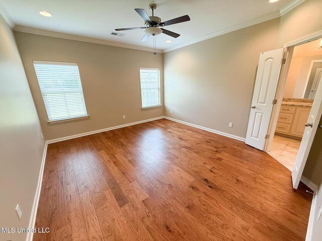 3041 Brambleberry Cv, Southaven, MS 38672 - empty room with a ceiling fan, light wood-style flooring, ornamental molding, and recessed lighting