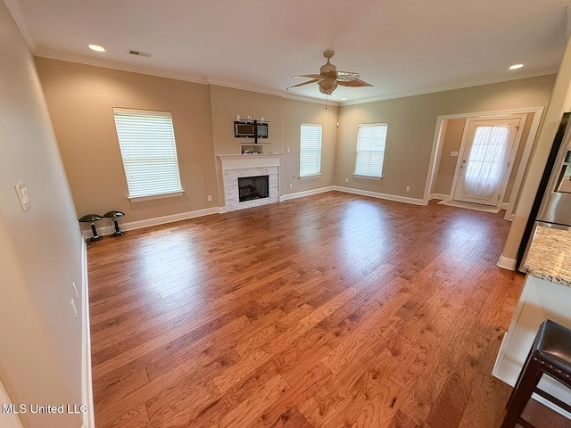 3041 Brambleberry Cv, Southaven, MS 38672 - unfurnished living room with ceiling fan, crown molding, wood finished floors, a fireplace, and recessed lighting