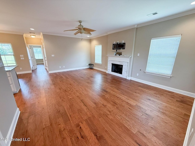 3041 Brambleberry Cv, Southaven, MS 38672 - unfurnished living room with a fireplace, ceiling fan, light wood finished floors, and crown molding