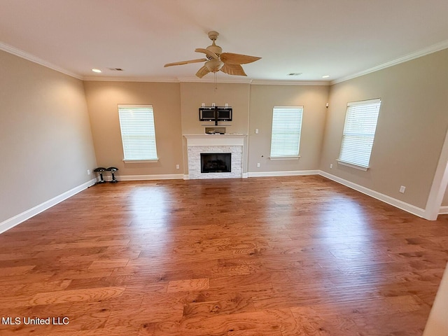 3041 Brambleberry Cv, Southaven, MS 38672 - unfurnished living room with ceiling fan, a fireplace, recessed lighting, wood finished floors, and crown molding