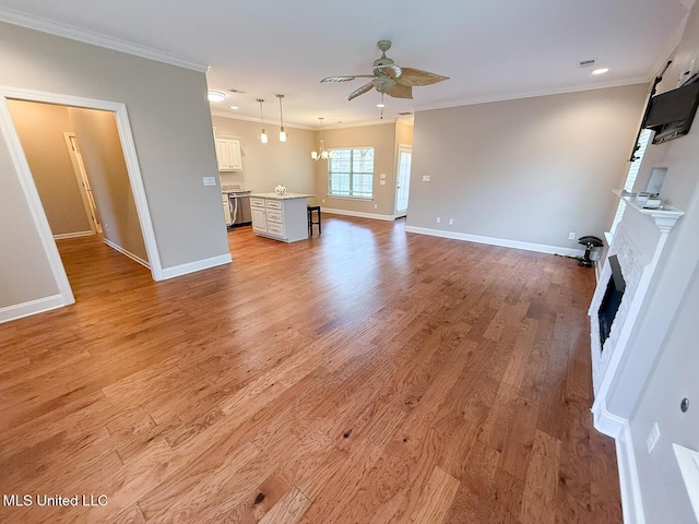 3041 Brambleberry Cv, Southaven, MS 38672 - unfurnished living room with a ceiling fan, a fireplace, crown molding, light wood-type flooring, and recessed lighting
