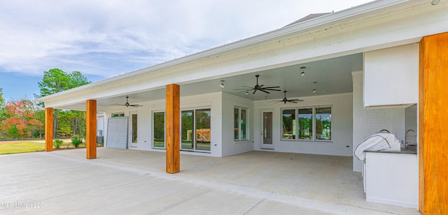 view of patio / terrace featuring sink and ceiling fan