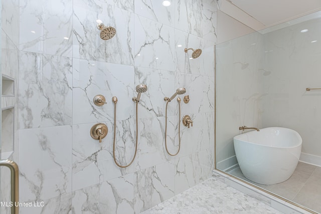 bathroom featuring shower with separate bathtub