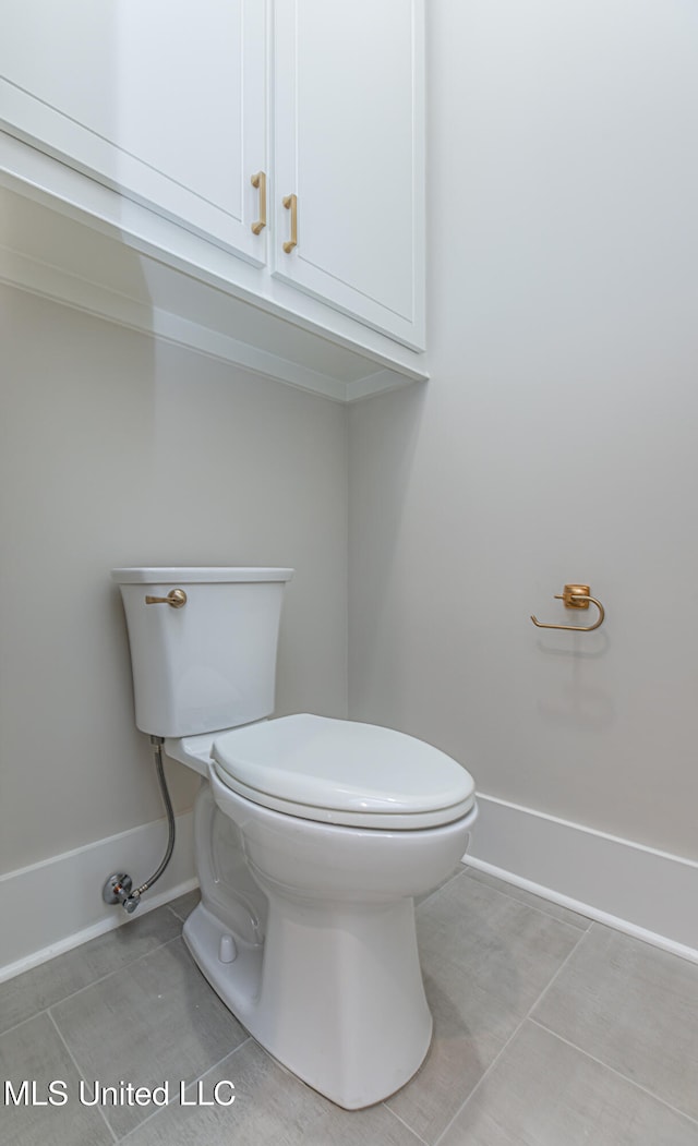 bathroom with tile patterned floors and toilet