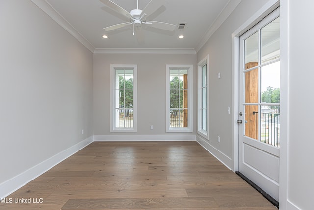 unfurnished room featuring ornamental molding, wood-type flooring, and ceiling fan