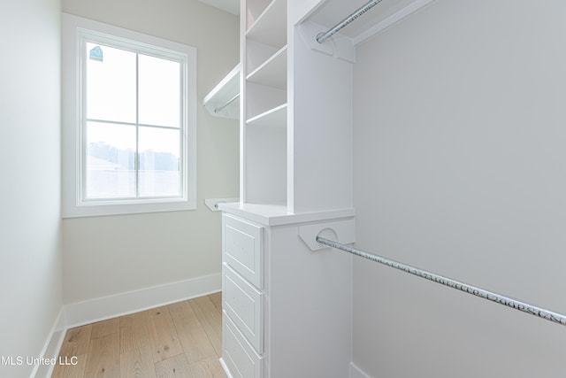 walk in closet featuring light wood-type flooring