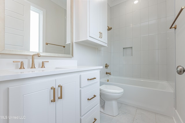 full bathroom featuring toilet, vanity, tiled shower / bath, and tile patterned flooring