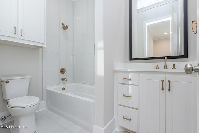 full bathroom featuring tiled shower / bath, toilet, and vanity