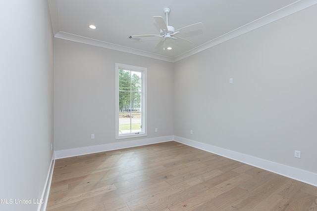 empty room with ornamental molding, light hardwood / wood-style flooring, and ceiling fan