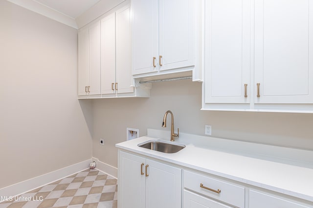 laundry area with hookup for an electric dryer, washer hookup, cabinets, and sink