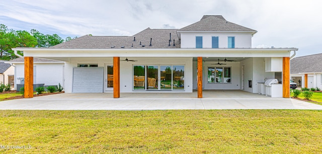 back of house with ceiling fan, a lawn, and a patio area