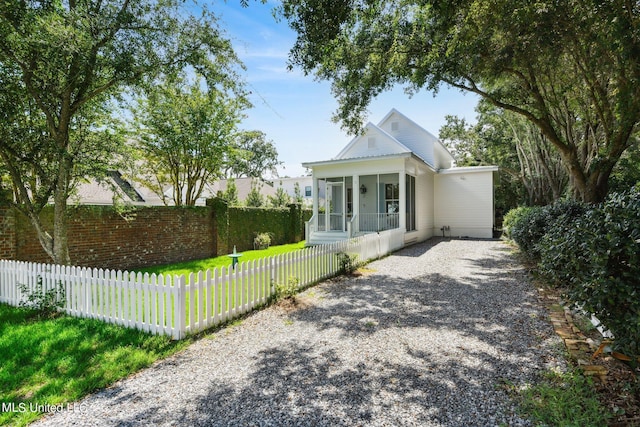 view of front of home with a sunroom