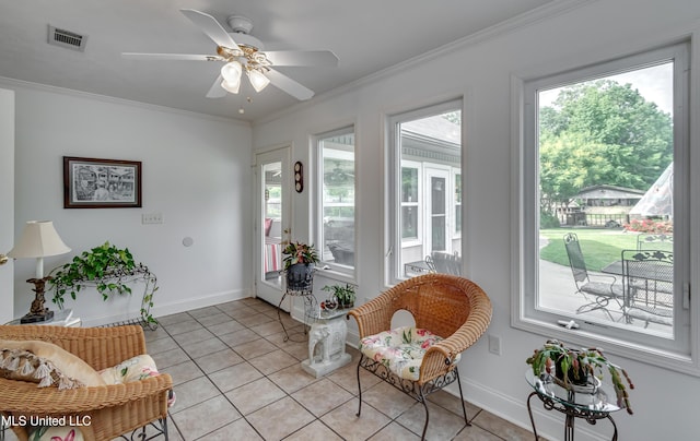 218 Harbor Ln, Brandon, MS 39047 - sitting room with light tile patterned floors, ceiling fan, baseboards, and crown molding