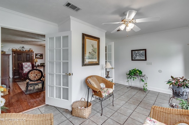 218 Harbor Ln, Brandon, MS 39047 - sitting room with light tile patterned flooring, ceiling fan, crown molding, and baseboards