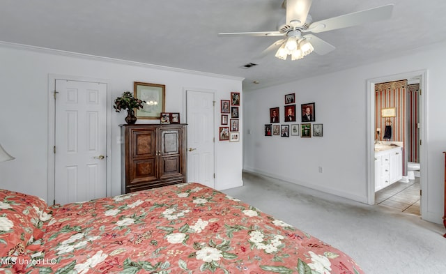 218 Harbor Ln, Brandon, MS 39047 - bedroom with light carpet, crown molding, ensuite bath, a ceiling fan, and baseboards