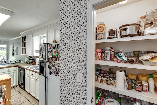 218 Harbor Ln, Brandon, MS 39047 - kitchen featuring white refrigerator with ice dispenser, open shelves, dishwasher, light tile patterned floors, and white cabinetry