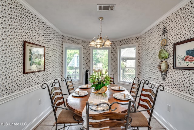 218 Harbor Ln, Brandon, MS 39047 - dining room with crown molding, wallpapered walls, wainscoting, baseboards, and a chandelier