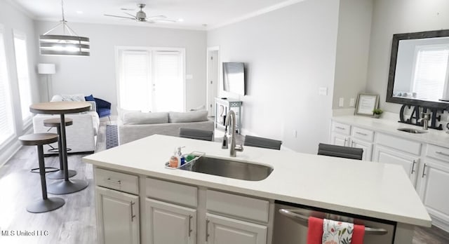 183 Mcdonnell Ave Unit 305, Biloxi, MS 39531 - kitchen with stainless steel dishwasher, wood finished floors, ceiling fan, open floor plan, and light countertops