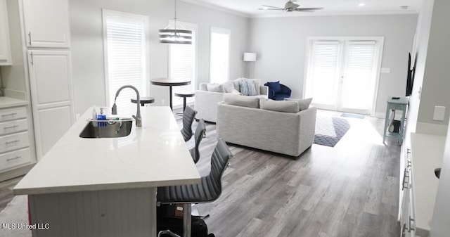 183 Mcdonnell Ave Unit 305, Biloxi, MS 39531 - dining room with light wood-style floors, crown molding, and ceiling fan