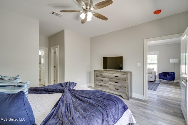 183 Mcdonnell Ave Unit 305, Biloxi, MS 39531 - bedroom featuring light wood finished floors, a ceiling fan, and ensuite bathroom