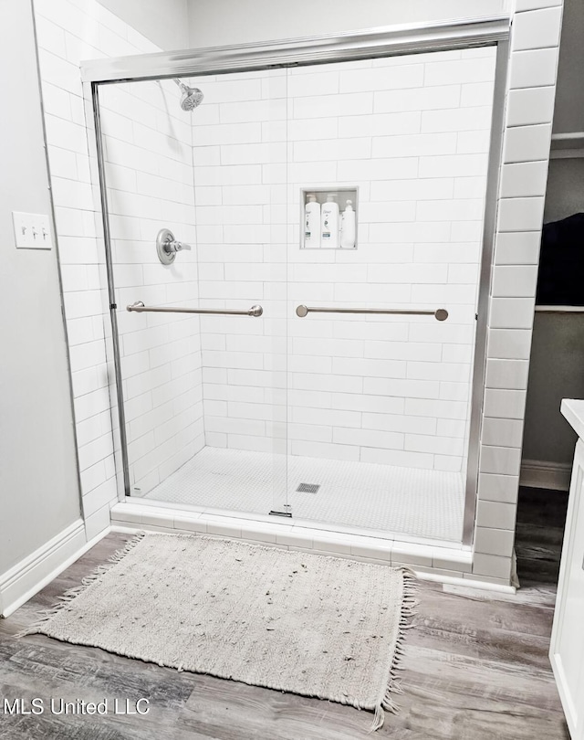 183 Mcdonnell Ave Unit 305, Biloxi, MS 39531 - full bath with wood finished floors and a stall shower