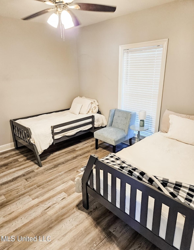 183 Mcdonnell Ave Unit 305, Biloxi, MS 39531 - bedroom with wood finished floors and a ceiling fan