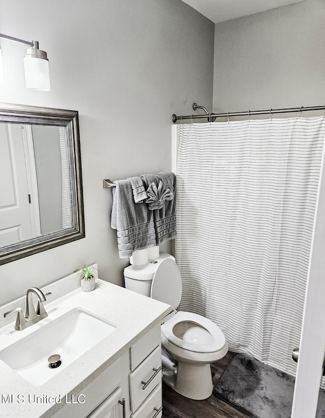 183 Mcdonnell Ave Unit 305, Biloxi, MS 39531 - bathroom with vanity, wood finished floors, and curtained shower