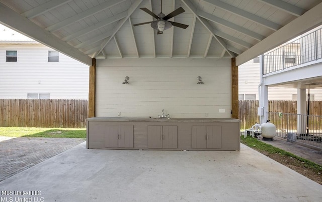 183 Mcdonnell Ave Unit 305, Biloxi, MS 39531 - fenced backyard with a ceiling fan and a patio