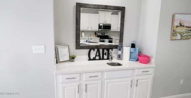 183 Mcdonnell Ave Unit 305, Biloxi, MS 39531 - bar featuring appliances with stainless steel finishes and a sink