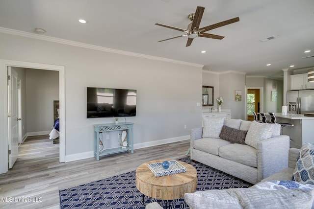 183 Mcdonnell Ave Unit 305, Biloxi, MS 39531 - living area with ceiling fan, light wood-style flooring, ornamental molding, and recessed lighting