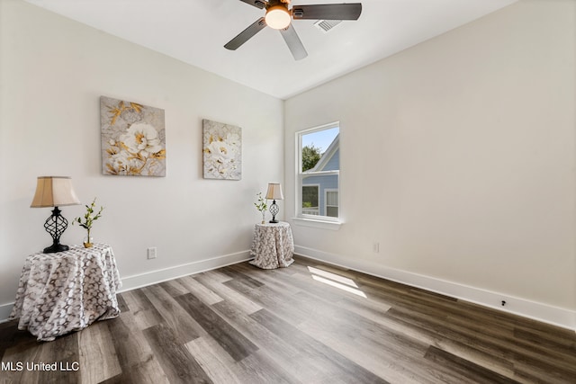 unfurnished room with hardwood / wood-style flooring and ceiling fan