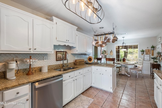 9948 Victor Dr, Olive Branch, MS 38654 - kitchen with dishwasher, a sink, white cabinetry, and decorative backsplash