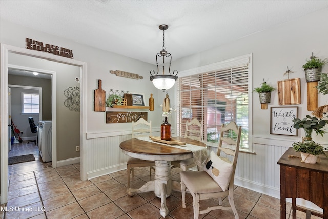 9948 Victor Dr, Olive Branch, MS 38654 - tiled dining space with a wainscoted wall