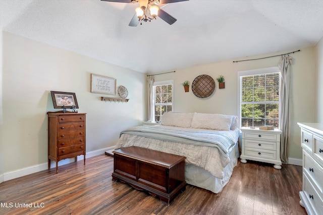 9948 Victor Dr, Olive Branch, MS 38654 - bedroom featuring lofted ceiling, dark wood-style flooring, baseboards, and a ceiling fan