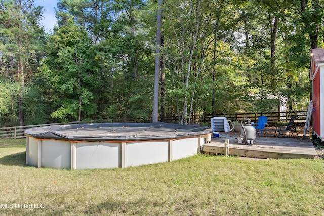 9948 Victor Dr, Olive Branch, MS 38654 - view of yard featuring a deck and a covered pool