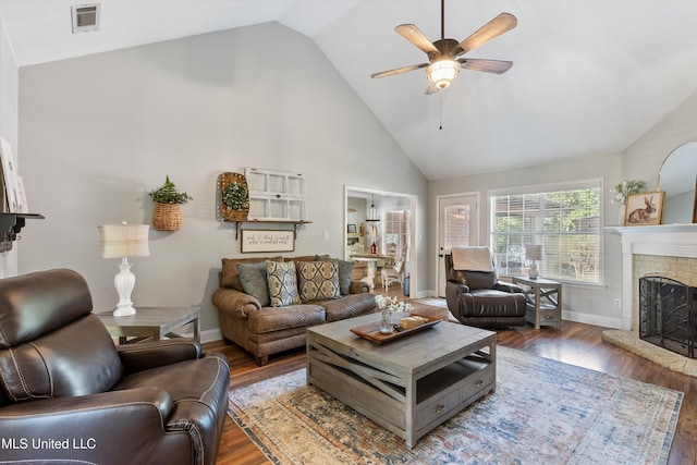 9948 Victor Dr, Olive Branch, MS 38654 - living area featuring a ceiling fan, a fireplace, wood finished floors, high vaulted ceiling, and baseboards