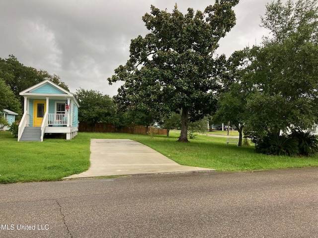 305 S Cleveland Ave, Long Beach, MS 39560 - view of front of home with a front lawn and covered porch