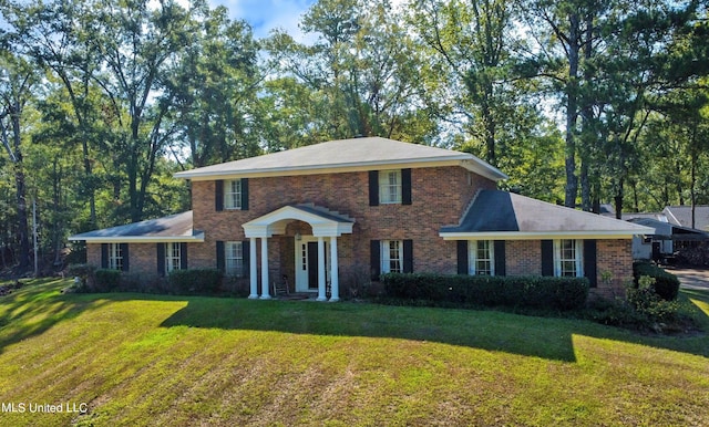 1870 Pine Hill Dr, Raymond, MS 39154 - colonial-style house featuring brick siding and a front lawn