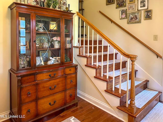 staircase featuring hardwood / wood-style flooring