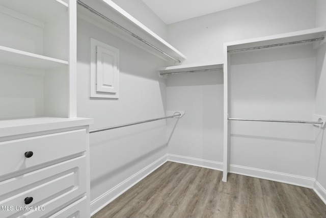 walk in closet featuring hardwood / wood-style floors