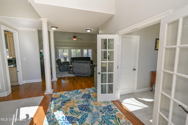 interior space with ornate columns, french doors, ceiling fan, and dark hardwood / wood-style floors