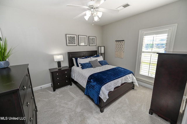 bedroom featuring light carpet and ceiling fan