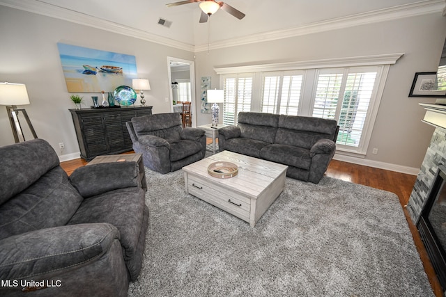 living room with a fireplace, hardwood / wood-style flooring, ceiling fan, and ornamental molding