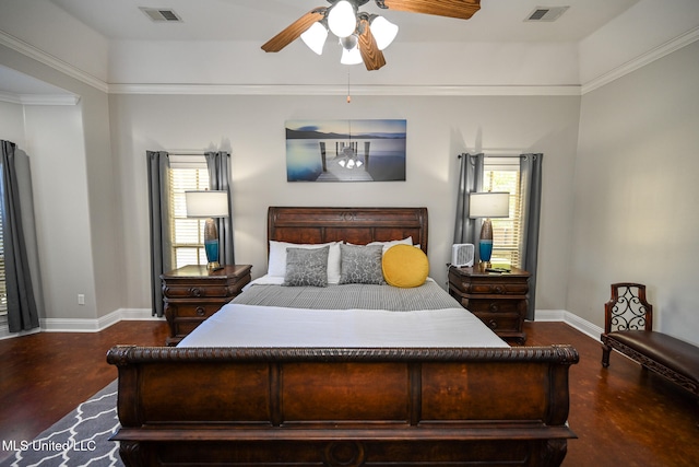 bedroom with ceiling fan, dark hardwood / wood-style floors, multiple windows, and crown molding