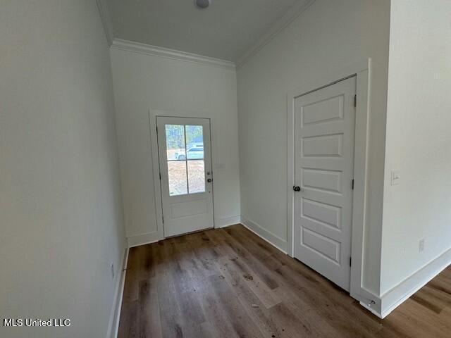 doorway featuring light hardwood / wood-style flooring and crown molding