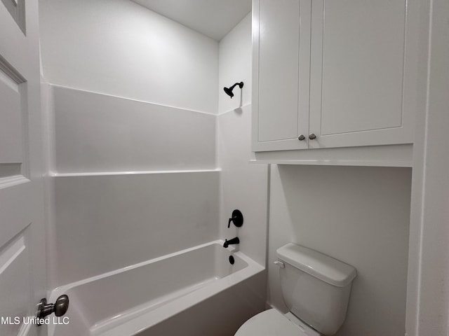 bathroom with toilet and washtub / shower combination