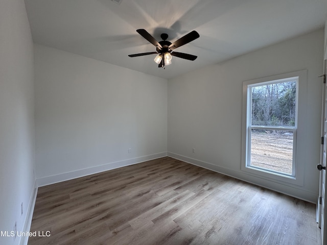 unfurnished room with ceiling fan and light hardwood / wood-style flooring