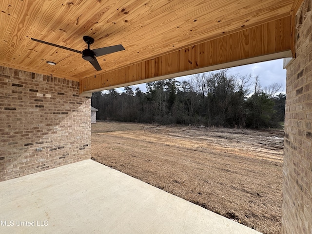 view of patio featuring ceiling fan