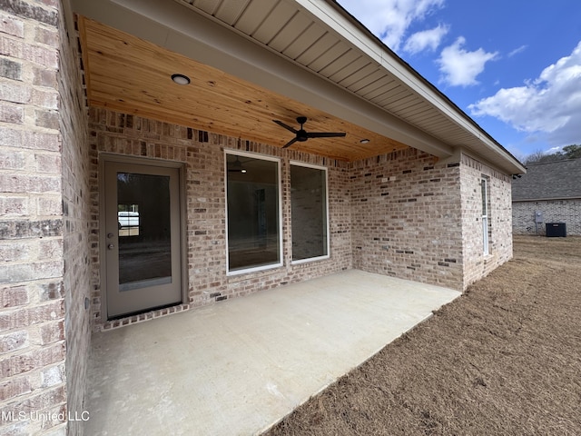 view of patio / terrace with central air condition unit and ceiling fan