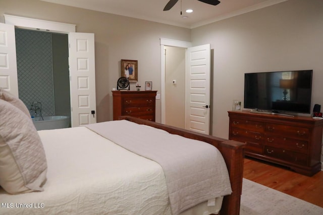 bedroom with recessed lighting, wood finished floors, a ceiling fan, and ornamental molding